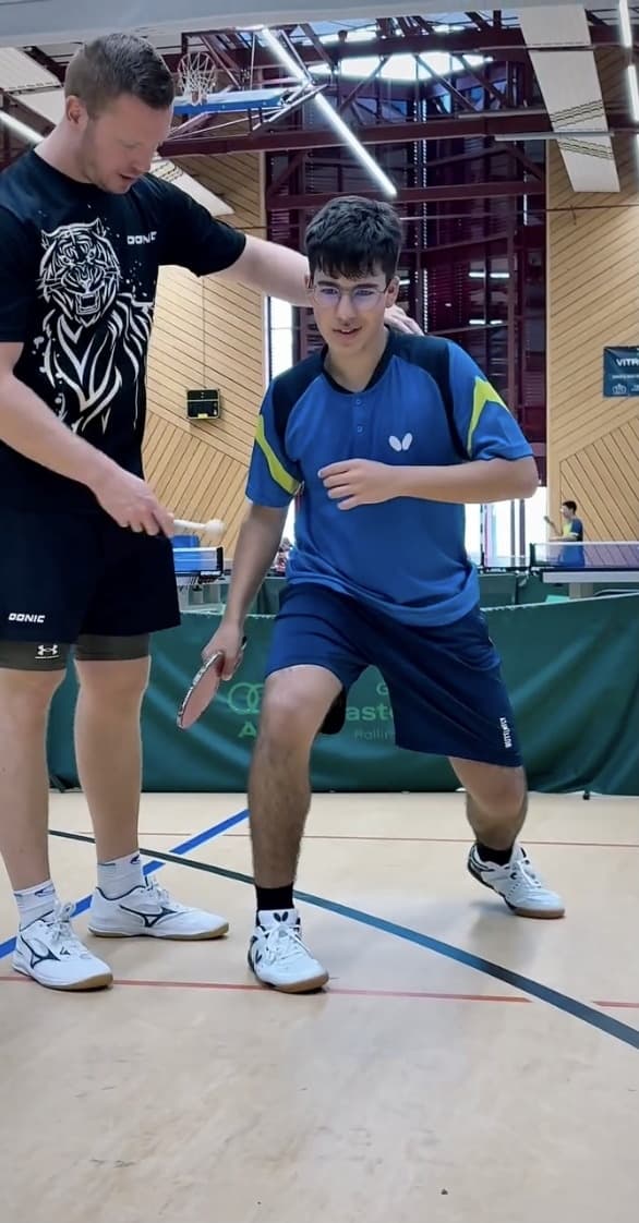 A Fortress coach guiding a player through a footwork exercise