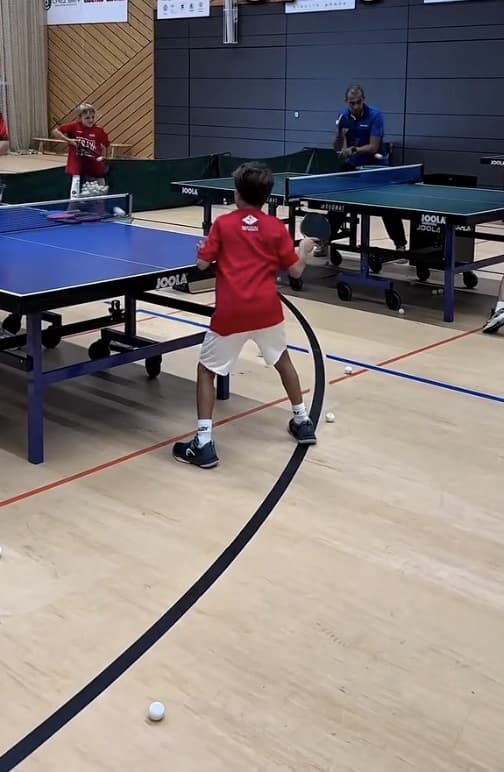 Players working through a table tennis training drill during the Fortress Summer Camp